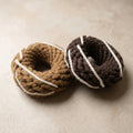 Handcrafted rope donut dog toys in caramel and dark brown