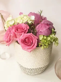 Handwoven jute loop basket used as compact decor