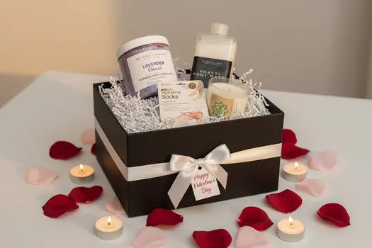 Body-care products and candle in spa gift box