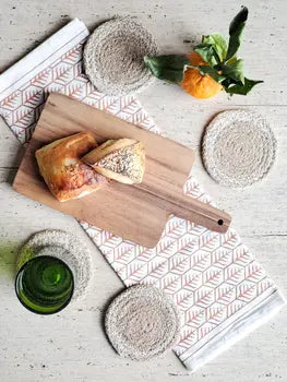 Handwoven drink coasters used on a tabletop