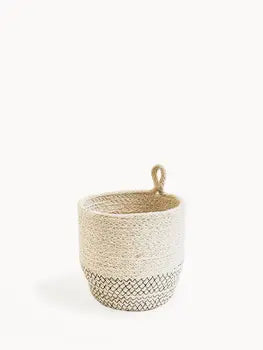 Off-white handwoven jute loop basket with black stitching
