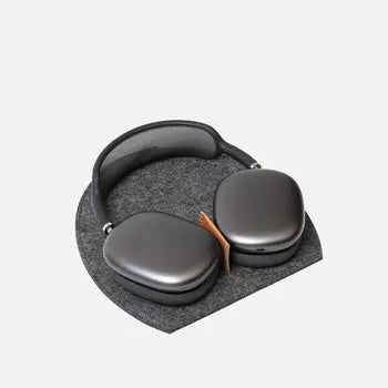 AirPods Max resting on merino felt stand