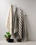 Four charcoal cotton kitchen towels with textured weaves