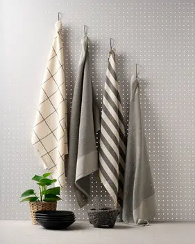 Four charcoal cotton kitchen towels with textured weaves